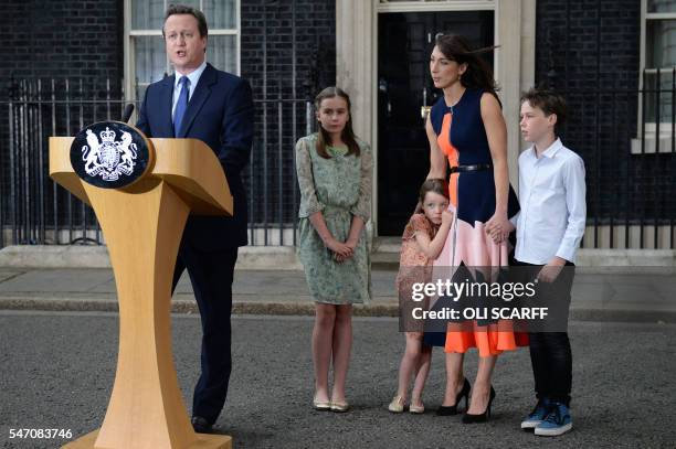 Outgoing British prime minister David Cameron speaks beside his daughter Nancy Gwen, daughter Florence Rose Endellion, his wife Samantha Cameron and...