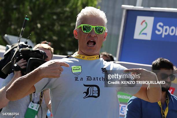 Russia's Tinkoff cycling team owner Oleg Tinkov reacts at the end of the 162,5 km eleventh stage of the 103rd edition of the Tour de France cycling...