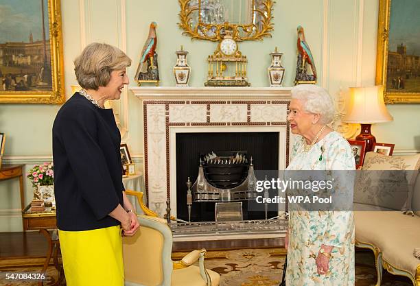 Queen Elizabeth II welcomes Theresa May at the start of an audience where she invited the former Home Secretary to become Prime Minister and form a...