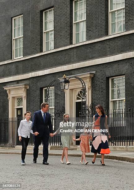 Outgoing British prime minister David Cameron leaves after speaking outside 10 Downing Street with his family son Arthur Elwen, his daughter Nancy...