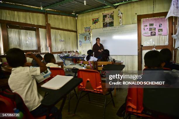 Students attend a class at the Adolfo Lopez Mateos school, in Villa de Zaachila, Oaxaca State, Mexico on July 5, 2016. / TO GO WITH AFP STORY BY...