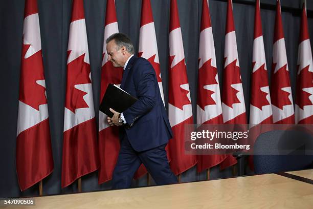 Stephen Poloz, governor of the Bank of Canada, exits after a press conference in Ottawa, Ontario, Canada, on Wednesday, July 13, 2016. Poloz held his...