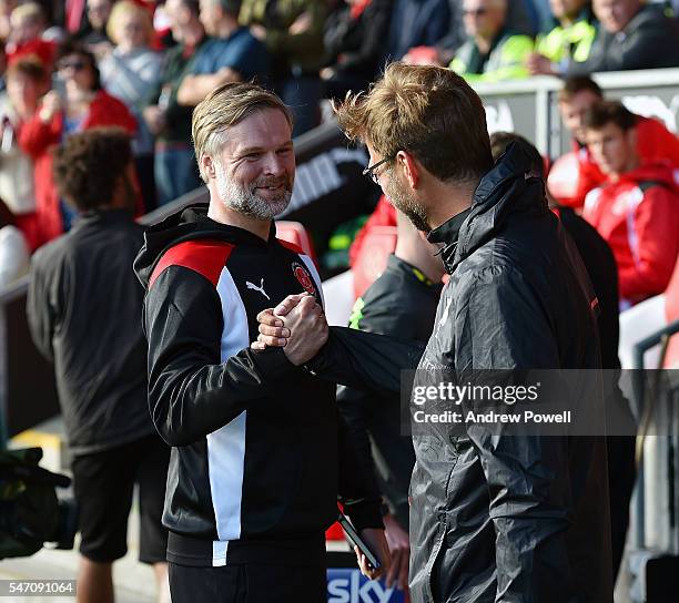 Jurgen Klopp manager of Liverpool with Steven Pressley manger of Fleetwood Town at the start of the Pre-Season Friendly match bewteen Fleetwood Town...