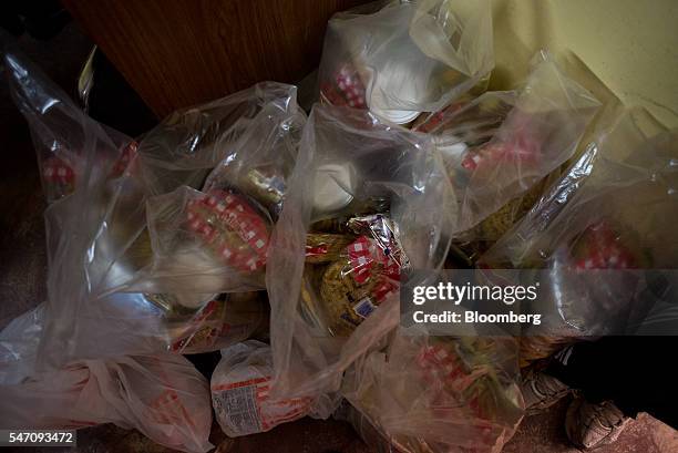 Plastic bags filled with groceries sit waiting to be delivered by CLAPs in the Catia neighborhood on the outskirts of Caracas, Venezuela, on...