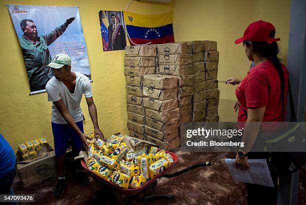 CLAPs members sort groceries for delivery in the Catia neighborhood on the outskirts of Caracas, Venezuela, on Saturday, July 2, 2016. In an attempt...