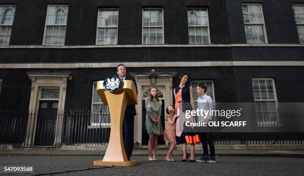 Outgoing British prime minister David Cameron speaks beside his daughter Nancy Gwen, daughter Florence Rose Endellion, his wife Samantha Cameron and...