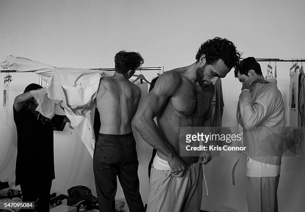 Model prepares backstage before the Deveaux show at Spring Studios on July 13, 2016 in New York City.