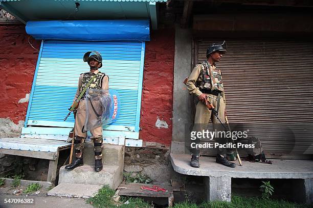 Government forces stand alert in curfew at old Srinagar the summer capital of India controlled by Kashmir.