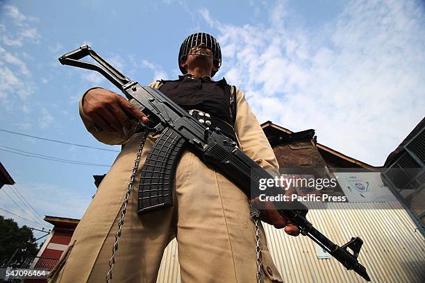 An Indian paramilitary trooper stand alert in curfew at old Srinagar the summer capital of India controlled by Kashmir.