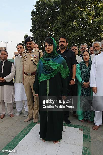 Jammu and Kashmir Chief Minister Mehbooba Mufti pays floral tributes on graves as she attends a ceremony to mark 84th anniversary of Martyr's Day in...