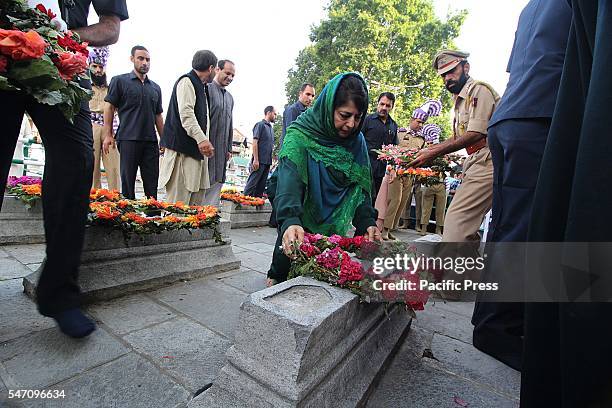 Jammu and Kashmir Chief Minister Mehbooba Mufti pays floral tributes on graves as she attends a ceremony to mark 84th anniversary of Martyr's Day in...