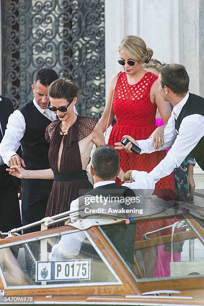 Guests leave the Aman Grand Canal Hotel to reach the church of the wedding of Bastian Schweinsteiger and Ana Ivanovic on July 13, 2016 in Venice,...