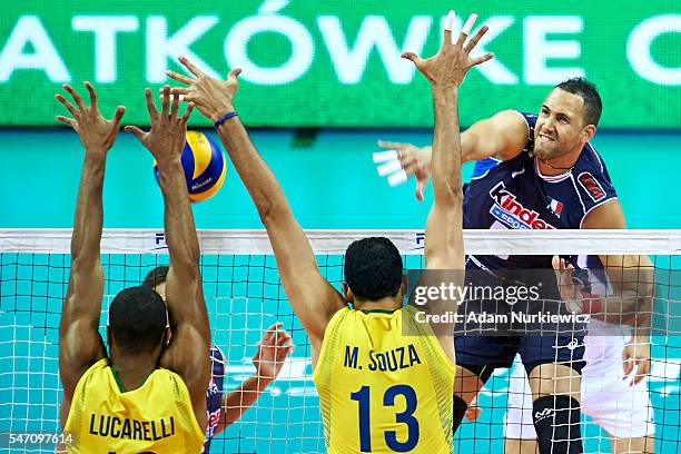 Osmany Juantorena from Italy attacks against Ricardo Lucarelli Santos De Souza from Brazil and Mauricio Souza from Brazil while the FIVB World League...