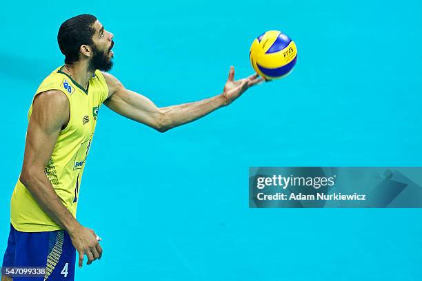 Ricardo Lucarelli Santos De Souza from Brazil serves the ball while the FIVB World League volleyball match between Brazil and Italy at Tauron Arena...