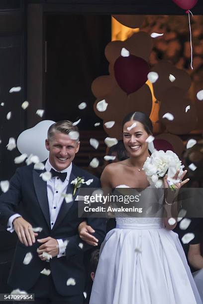 Bastian Schweinsteiger and Ana Ivanovic leave the church after their wedding on July 13, 2016 in Venice, Italy.