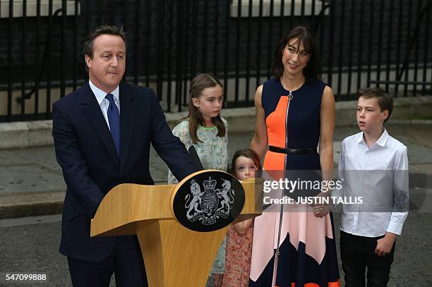 Outgoing British prime minister David Cameron speaks beside his daughter Nancy Gwen, daughter Florence Rose Endellion, his wife Samantha Cameron and...