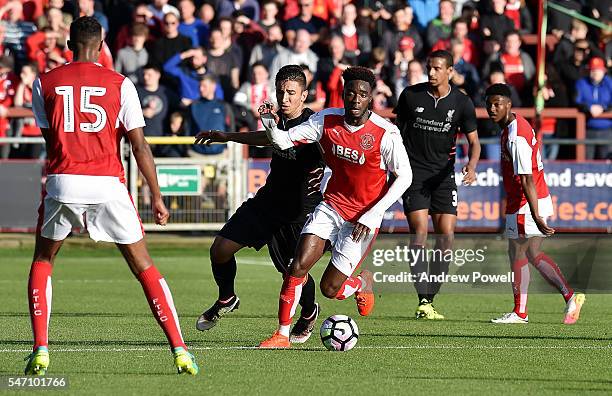 Marko Grujic of Liverpool competes with Devante Cole of Fleetwood Town during the Pre-Season Friendly match bewteen Fleetwood Town and Liverpool at...