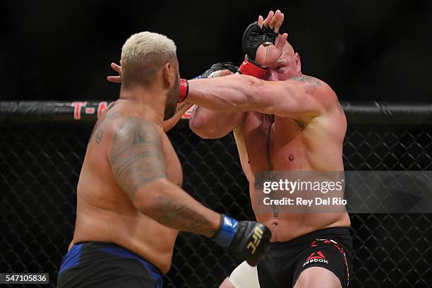 Mark Hunt punches Brock Lesnar during the UFC 200 event at T-Mobile Arena on July 9, 2016 in Las Vegas, Nevada.