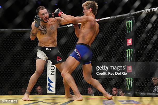 Enrique Marin punches Sage Northcutt during the UFC 200 event at T-Mobile Arena on July 9, 2016 in Las Vegas, Nevada.
