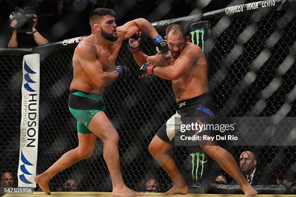 Kelvin Gastelum punches Johny Hendricks during the UFC 200 event at T-Mobile Arena on July 9, 2016 in Las Vegas, Nevada.