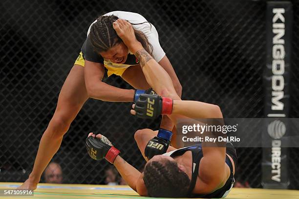 Cat Zingano kicks Julianna Pena during the UFC 200 event at T-Mobile Arena on July 9, 2016 in Las Vegas, Nevada.