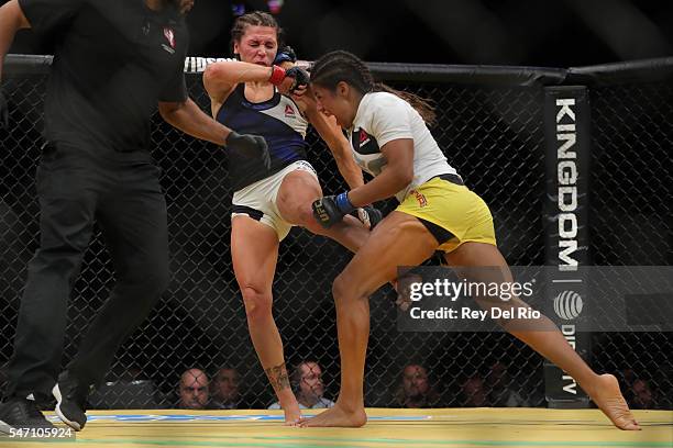 Julianna Pena punches Cat Zingano during the UFC 200 event at T-Mobile Arena on July 9, 2016 in Las Vegas, Nevada.