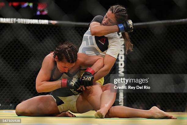 Julianna Pena punches Cat Zingano during the UFC 200 event at T-Mobile Arena on July 9, 2016 in Las Vegas, Nevada.