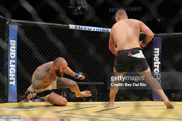 Cain Velasquez punches Travis Browne during the UFC 200 event at T-Mobile Arena on July 9, 2016 in Las Vegas, Nevada.