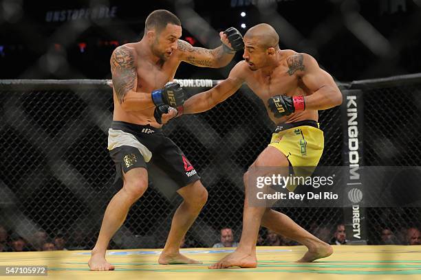 Frankie Edgar punches Jose Aldo during the UFC 200 event at T-Mobile Arena on July 9, 2016 in Las Vegas, Nevada.