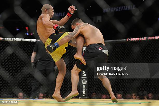 Jose Aldo knees Frankie Edgar during the UFC 200 event at T-Mobile Arena on July 9, 2016 in Las Vegas, Nevada.