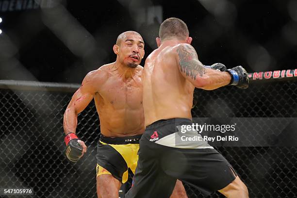 Frankie Edgar punches Jose Aldo during the UFC 200 event at T-Mobile Arena on July 9, 2016 in Las Vegas, Nevada.