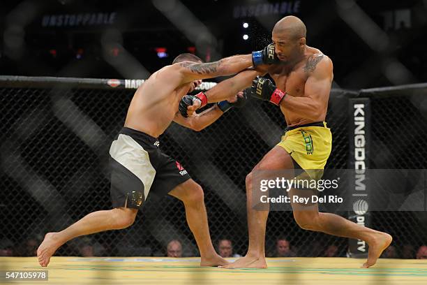 Frankie Edgar punches Jose Aldo during the UFC 200 event at T-Mobile Arena on July 9, 2016 in Las Vegas, Nevada.