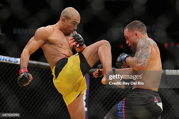 Jose Aldo looks to land a high knee on Frankie Edgar during the UFC 200 event at T-Mobile Arena on July 9, 2016 in Las Vegas, Nevada.