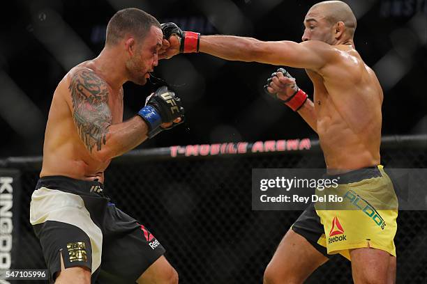 Jose Aldo punches Frankie Edgar during the UFC 200 event at T-Mobile Arena on July 9, 2016 in Las Vegas, Nevada.