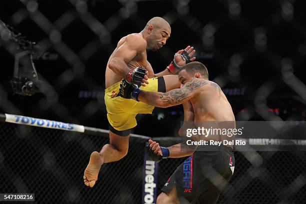 Jose Aldo knees Frankie Edgar during the UFC 200 event at T-Mobile Arena on July 9, 2016 in Las Vegas, Nevada.