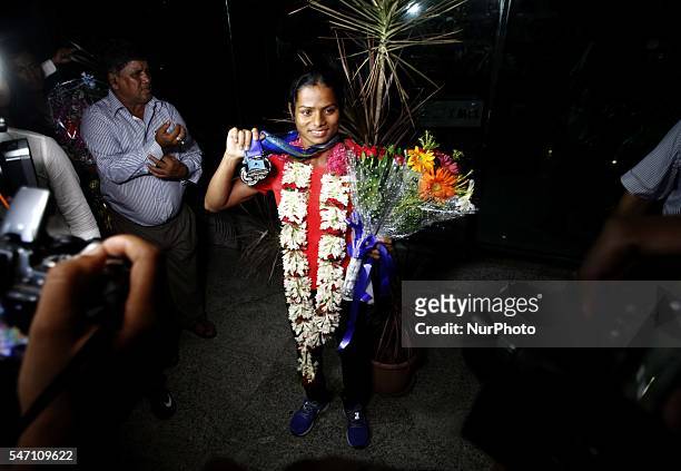 Indian spinter Dutee Chand faliciated by the public and sports students after her arrive in her home town after qualifing for the Rio Olympic at the...
