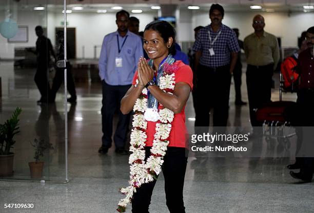 Indian spinter Dutee Chand faliciated by the public and sports students after her arrive in her home town after qualifing for the Rio Olympic at the...