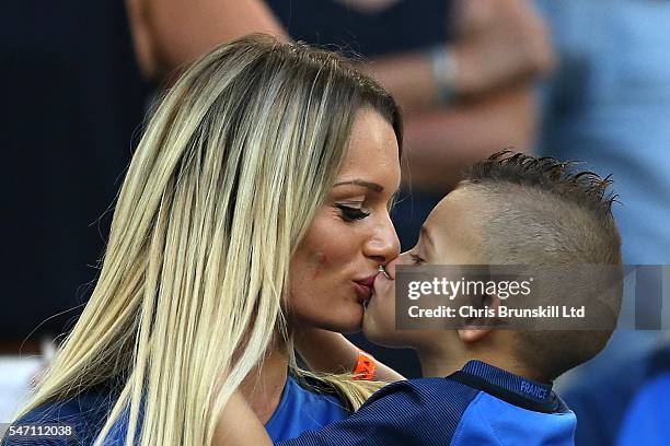 Ludivine Payet, wife of Dimitri Payet of France, kisses her child prior to the UEFA Euro 2016 Semi Final match between Germany and France at Stade...