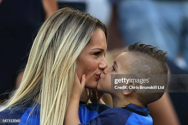 Ludivine Payet, wife of Dimitri Payet of France, kisses her child prior to the UEFA Euro 2016 Semi Final match between Germany and France at Stade...