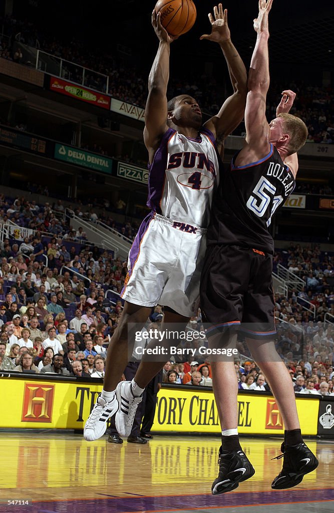 Alton Ford shoots over Michael Doleac