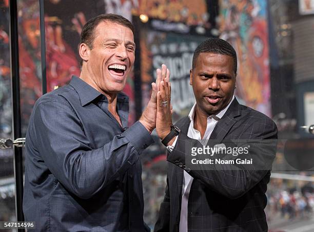 Calloway interviews Tony Robbins during his visit to "Extra" at H&M Times Square on July 13, 2016 in New York City.