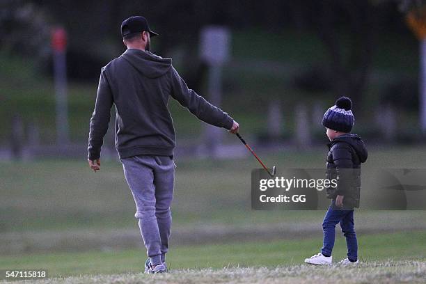 Guy Sebastian is seen teaching his son Hudson how to play golf on June 25, 2016 in Sydney, Australia.