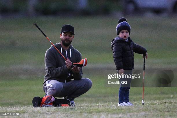 Guy Sebastian is seen teaching his son Hudson how to play golf on June 25, 2016 in Sydney, Australia.