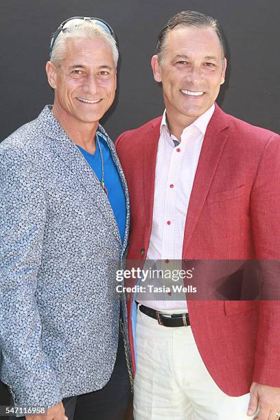 Diver Greg Louganis and Johnny Chaillott attend Greg Louganis' Pre- ESPY Awards Wheaties Breakfast for Champions at The Starving Artists Project on...