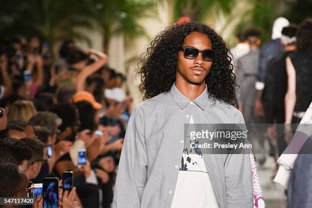 Model walks the runway at the Rochambeau front row during New York Fashion Week: Men's S/S 2017 at Skylight Clarkson Sq on July 13, 2016 in New York...