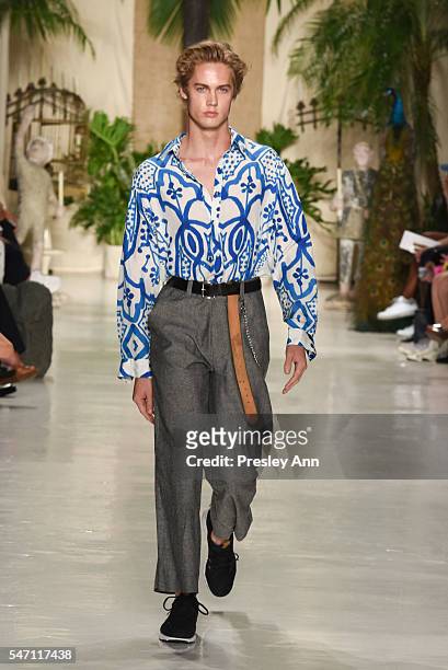 Model walks the runway at the Rochambeau front row during New York Fashion Week: Men's S/S 2017 at Skylight Clarkson Sq on July 13, 2016 in New York...