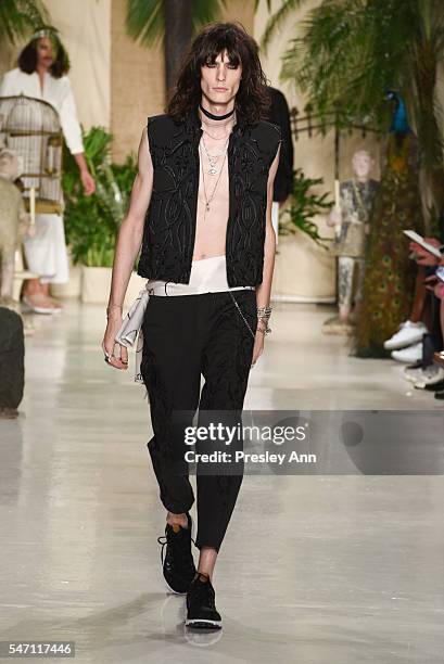 Model walks the runway at the Rochambeau front row during New York Fashion Week: Men's S/S 2017 at Skylight Clarkson Sq on July 13, 2016 in New York...