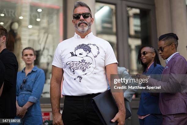 Garth Condit is seen attending the Suitsupply Presentation wearing Sacsi shirt, Unis pants, Public School shoes, and Tsatsas bag during New York...