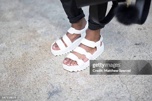 Thompson is seen attending the Artistix with Andy Hilfiger Presentation wearing Cole Haan glasses, D.Gnak shirt, Asos bag and shoes, and Boohoo pants...