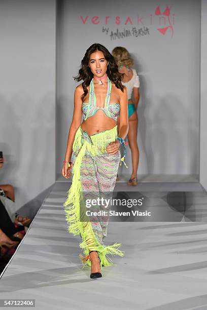 A model walks the runway at Versakini x Amanda Perna Runway Show Presented By Ivy at W South Beach on July 13, 2016 in Miami Beach, Florida.